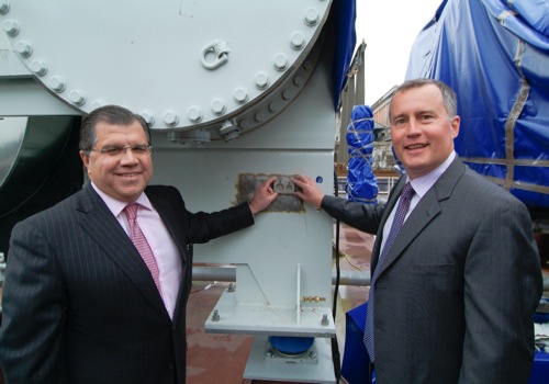 Oceania Cruises' executives Frank Del Rio, left, and Bob Binder celebrate the birth of Oceania's newest ship - Marina - during a keel laying ceremony in Italy over the weekend.